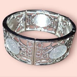 Silvery glitter filigree panel stretch bracelet approx 1 in wide